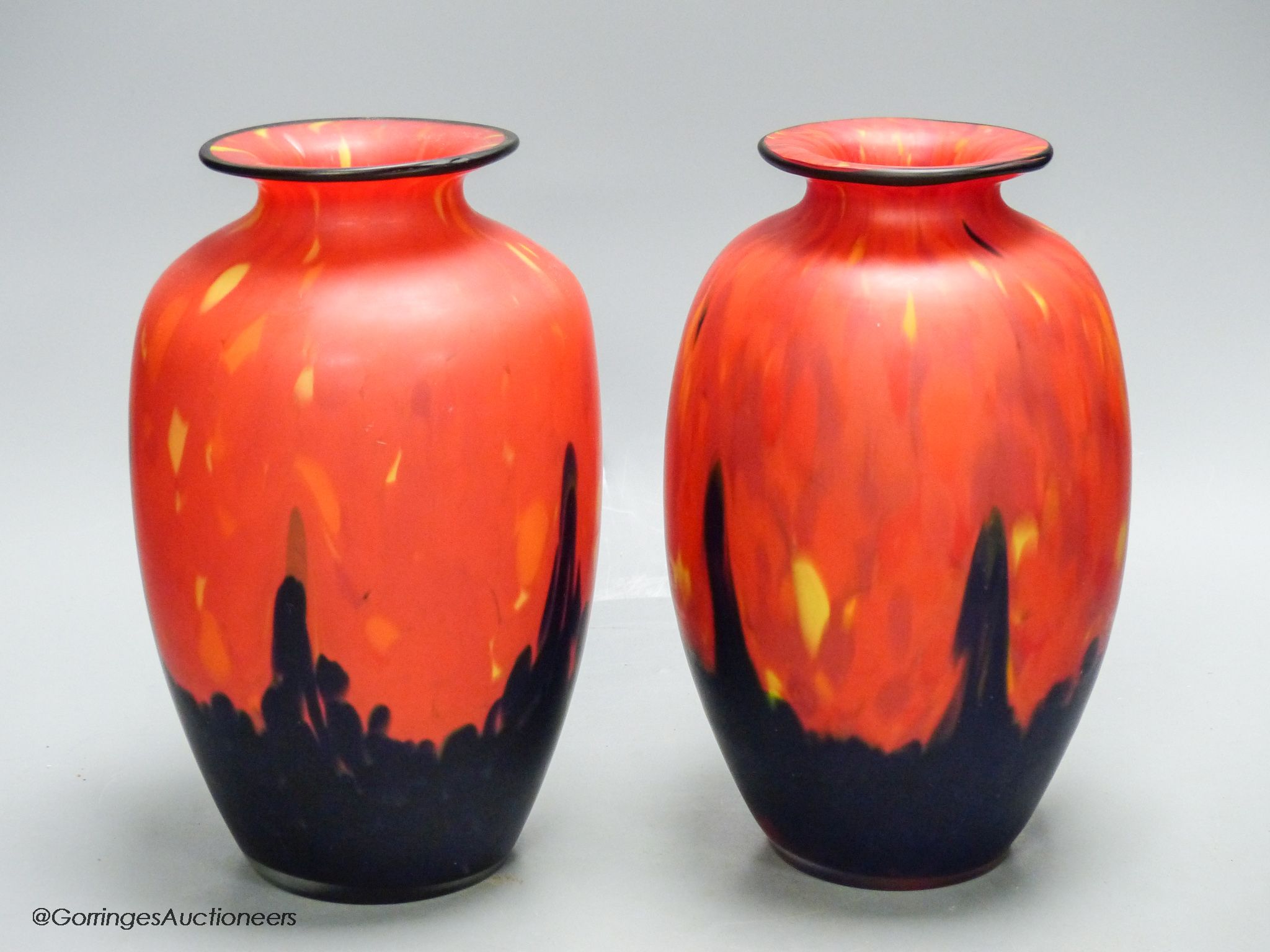 A pair of modern red and black art glass vases, height 23cm